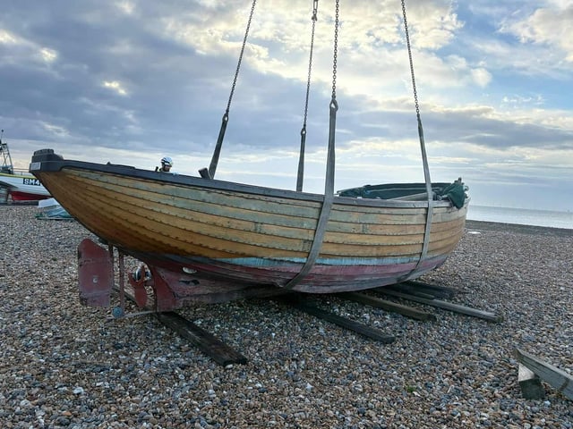 An historic clinker-built fishing boat was lowered down onto Worthing Beach ahead of restoration works.
