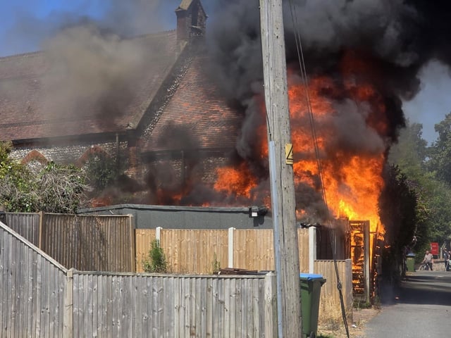 Firefighters tackle a blaze that destroyed two sheds, on Beaconsfield Road