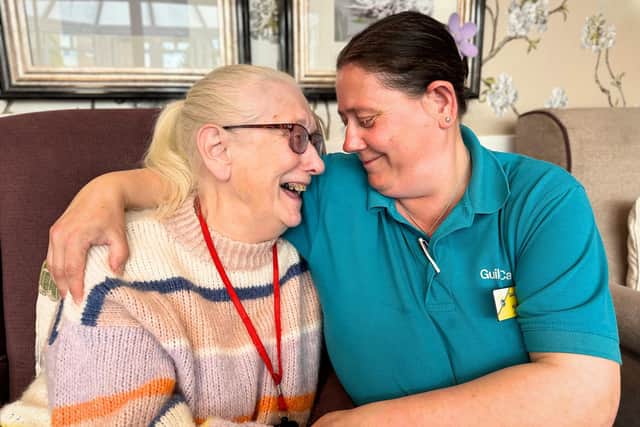 Resident enjoying one-to-one time with a carer