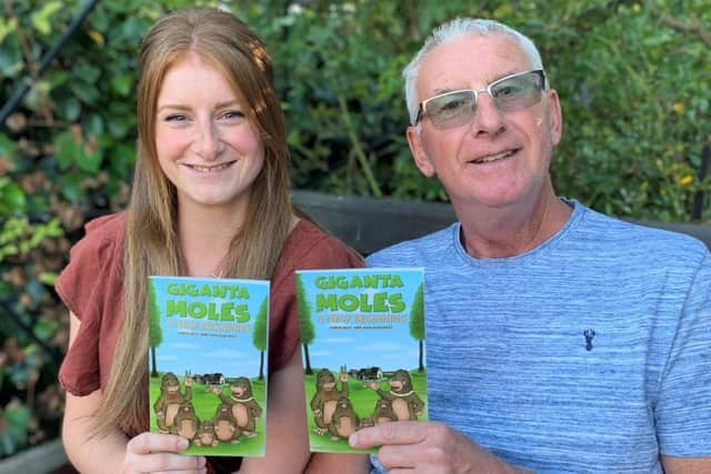 Chris and Ashleigh Best with their recently published book, Giganta Moles – A New Beginning
