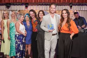 Q Hair and Beauty team accepting their Education Of The Year Award at Quaglino's St James, London