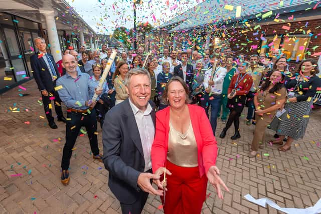 The opening of Wellbeing Square in Newhaven on Thursday, September 3. Leader of Lewes District Council Zoe Nicholson (front right), with Lewes MP James MacCleary (front left) and Duncan Kerr (far left, second row) Photo: Cripps Photography, via LDC.