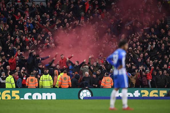 Crystal Palace fans let of smoke bombs at the Amex Stadium in a Premier League clash with Brighton