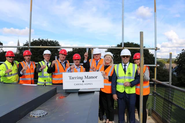 Sir Peter Bottomley with representatives from the Caring Homes team at Tarring Manor for the topping out ceremony