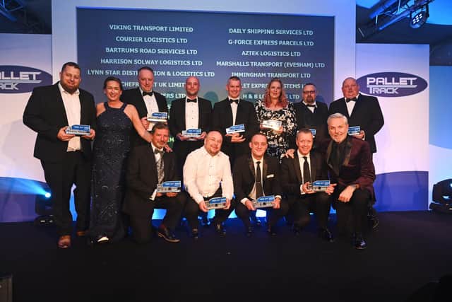 Hailsham haulier picks up national award from actor and comedian Brian Conley (photo from Pallet-Track Logistics)