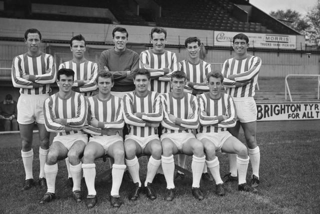 Unspecified Brighton & Hove Albion players pose for a team portrait at the club's home stadium, the Goldstone Ground, in Hove in November 1963. It was a decent season for Albion who finished 8th in Division Four, they would win the league the following season.