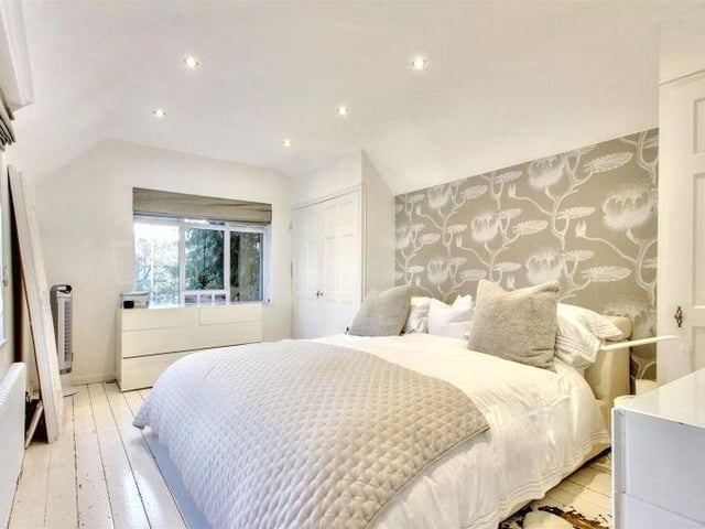 There are five first-floor bedrooms, with an en suite and dressing room to the double-aspect master bedroom