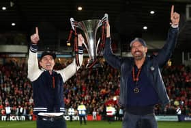 Rob McElhenney and Ryan Reynolds, Owners of Wrexham celebrate with the Vanarama National League trophy. (Photo by Jan Kruger/Getty Images)