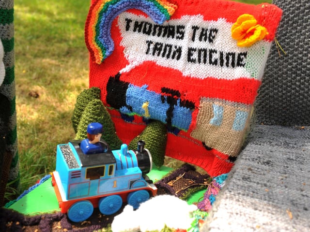 East Preston Yarnbombers have created an enchanting picnic area with chairs that are beautifully-decorated knitted masterpieces