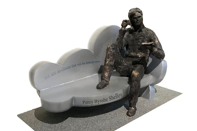 David A Annand – a simple design sculpture of a stainless-steel chaise-longue on an art deco cloud design with a bronze figure of Shelley reclining and reading.