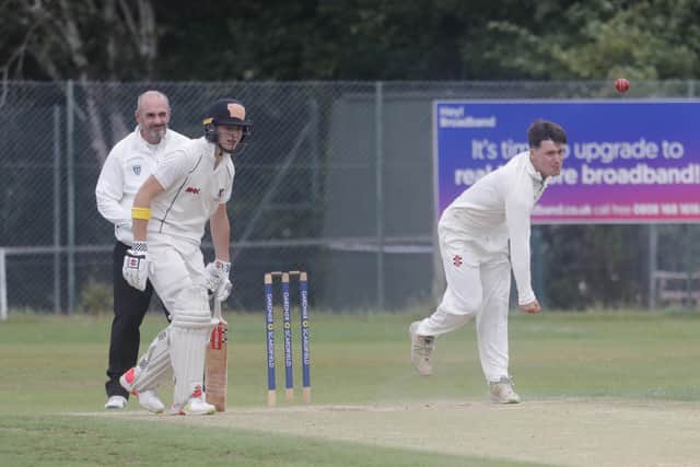 Ollie Blandford bowls for Three Bridges in their Sussex Cricket League Premier Division game at Horsham on Saturday. Bridges held on for the draw against title-chasers Horsham. Picture: John Lines