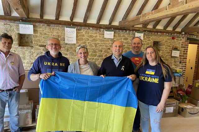 MP Andrew Griffith with one of the county's Ukraine Relief groups (Photo credit – Graham Whittington Lens Art)