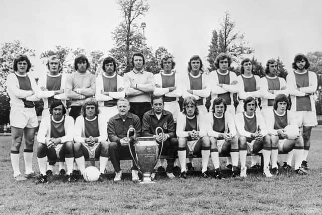 European Cup holders Ajax pose for a team photo in 1973.Front row left to right, Sjaak Swart, Johnny Rep, coach Stephan Kovacs, trainer Bob Haarms, Ger Kleton, Jan Mulder, Johan Cruyff and Gerrie Muhren. Back row, left to right, Arie Haan, Horst Blankenburg, Sies Wever, Wim Suurbier, goalkeeper Heinz Stuy, Piet Keizer, Ruud Krol, Heinz Schilcher, Arnold Muhren, Johan Neeskens and Barry Hulshoff. (Photo by Central Press/Hulton Archive/Getty Images)