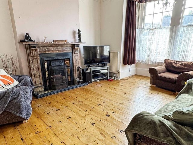 The lounge at the front is one of three reception rooms