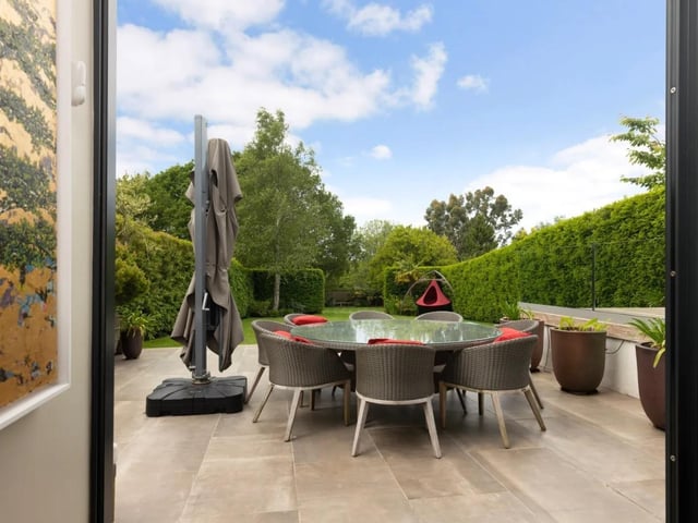 Immediately adjacent to the property is a wide paved terrace