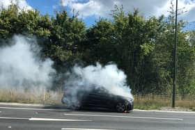 A car burst into flames on the A24 near Horsham. Photo: Hannah Miller