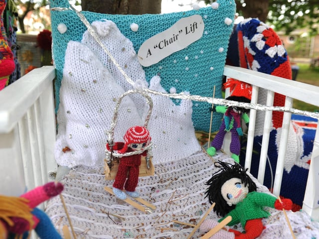 East Preston Yarnbombers have created an enchanting picnic area with chairs that are beautifully-decorated knitted masterpieces