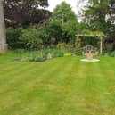 Herbaceous borders with pergola and sitting area