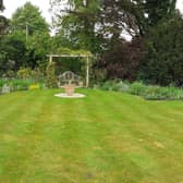 Herbaceous borders with pergola and sitting area