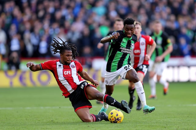 SHEFFIELD, ENGLAND - FEBRUARY 18: Yasser Larouci of Sheffield United battles for possession with Simon Adingra of Brighton & Hove Albion during the Premier League match between Sheffield United and Brighton & Hove Albion at Bramall Lane on February 18, 2024 in Sheffield, England. (Photo by Matt McNulty/Getty Images)