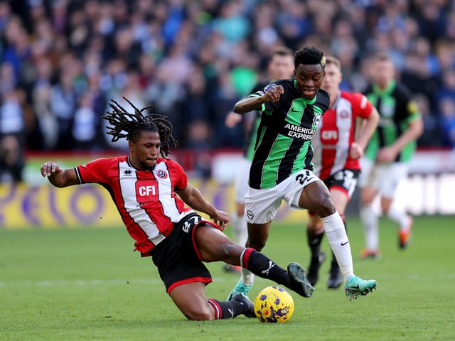 SHEFFIELD, ENGLAND - FEBRUARY 18: Yasser Larouci of Sheffield United battles for possession with Simon Adingra of Brighton & Hove Albion during the Premier League match between Sheffield United and Brighton & Hove Albion at Bramall Lane on February 18, 2024 in Sheffield, England. (Photo by Matt McNulty/Getty Images)