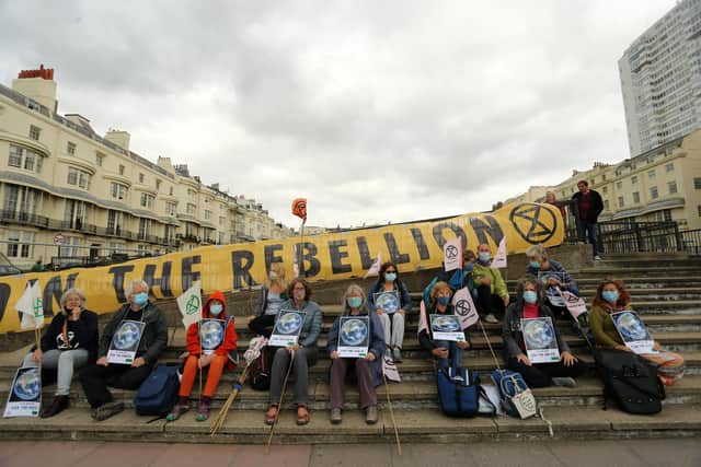 Activists from Extinction Rebellion Brighton are taking part in a nationwide campaign this December to highlight the need for urgent action on fuel poverty. Picture by ISABEL INFANTES/AFP via Getty Images