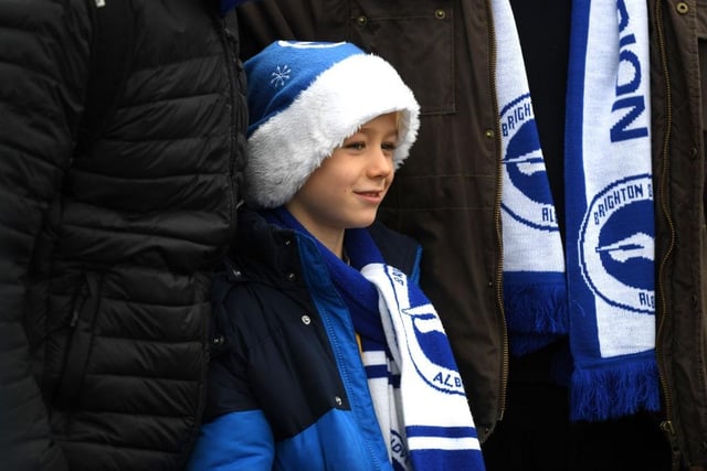 A young supporter awaits kick off ahead of the Premier League match between Brighton & Hove Albion and Chelsea FC at American Express Community Stadium on December 16, 2018.