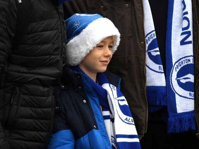 A young supporter awaits kick off ahead of the Premier League match between Brighton & Hove Albion and Chelsea FC at American Express Community Stadium on December 16, 2018.