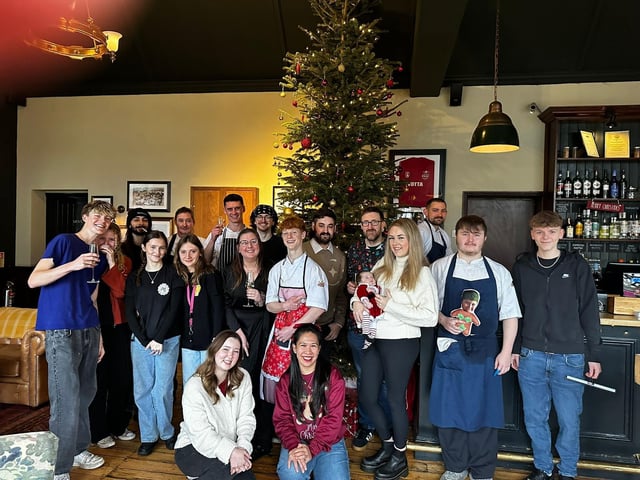 The team at The Thomas A Becket pub over the years