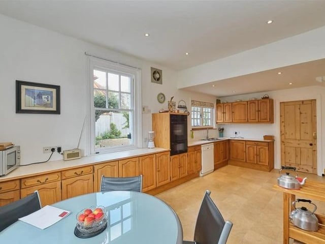 The dual aspect 20ft kitchen and breakfast room has stairs leading to the cellar and a door through to the sizeable utility room.