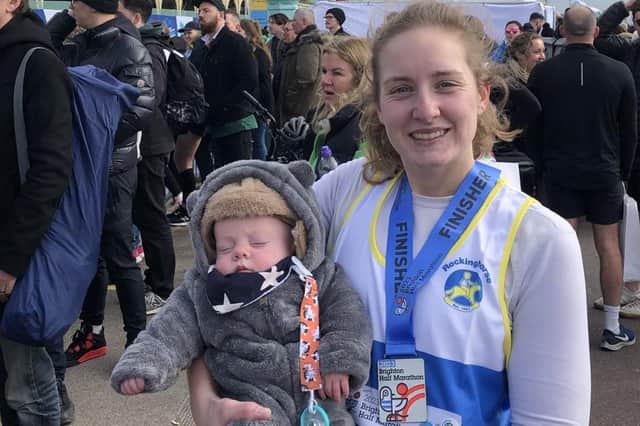 Megan with her nephew Issac after finishing the Brighton Half Marathon