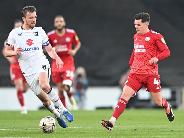 Crawley Town midfielder Liam Kelly (4) battles for possession with Milton Keynes Dons midfielder Alex Gilbey (8) during the EFL Sky Bet League 2 play-off second leg match between Milton Keynes Dons and Crawley Town at stadium:mk, Milton Keynes, England on 11 May 2024.:Crawley Town hammered MK Dons 5-1 - and 8-1 on aggregate - to reach the League Two play-off final Wembley. Photographer Dennis Goodwin/Pro Sport Images was there to catch the action, the crowd and the celebrations