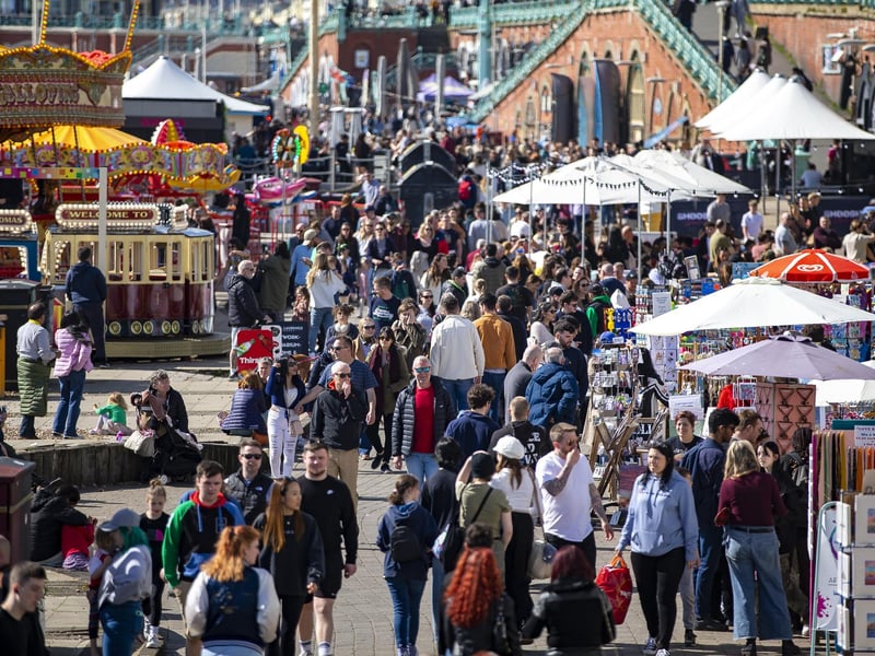 People enjoy the spring sunshine this Good Friday on Brighton seafront in East Sussex.