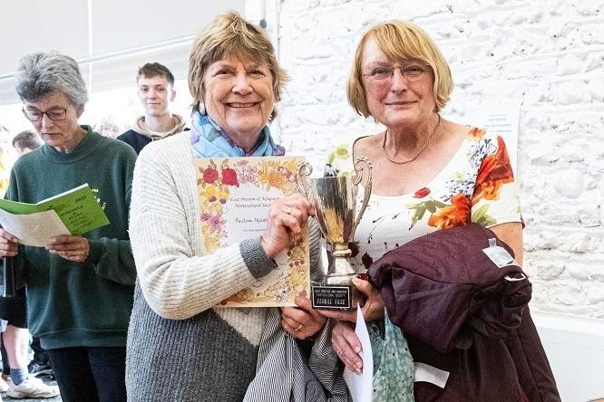 Pauline McLelland and Janet Samwell receive the Floral Vase for floral arrangements