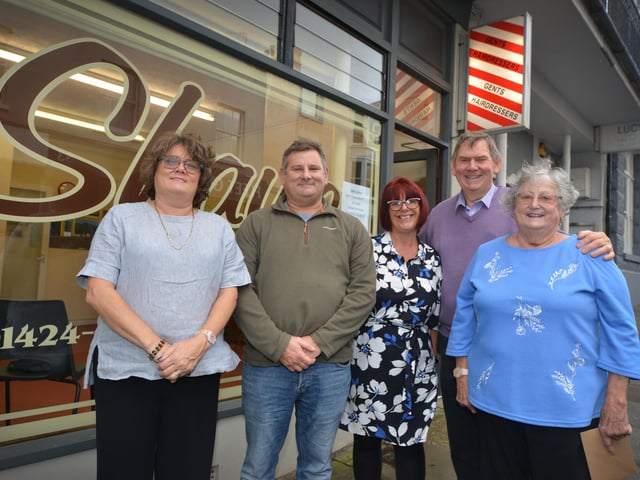 Shaw's hairdressers, Norman Road, St Leonards, is closing its doors after 78 years of trading. Michael and Sue pictured with their children.