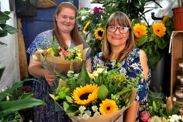 Little Flower Shop owner Emily Kent and colleague Karen Reid celebrate 18 months in business