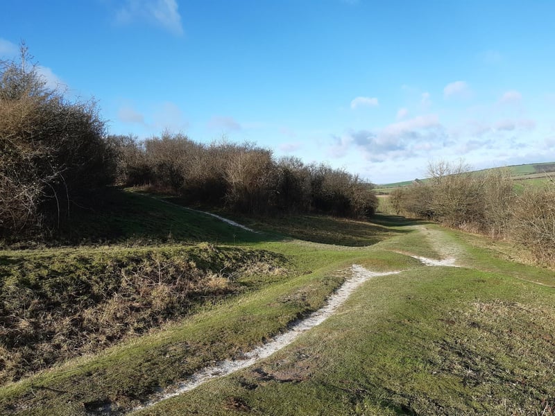 Just follow this path (centre), wrapping around the hill as you descend. Do not turn off at any crossroads.