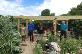 With the help of volunteers, Creative Waves has created a new pergola for the BugCycle Community Garden with a green vine and jasmine roof