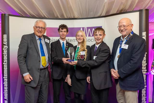 Sir Peter Bottomley and Alistair Somerville, president of the Institute of Acoustics, with the winning team from St Oscar Romero Catholic School in Goring. Picture: Andrew Dunsmore