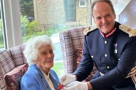 Joan Willett is awarded the BEM by Lord-Lieutenant of East Sussex, Mr Andrew Blackman CStJ. Picture: Contributed