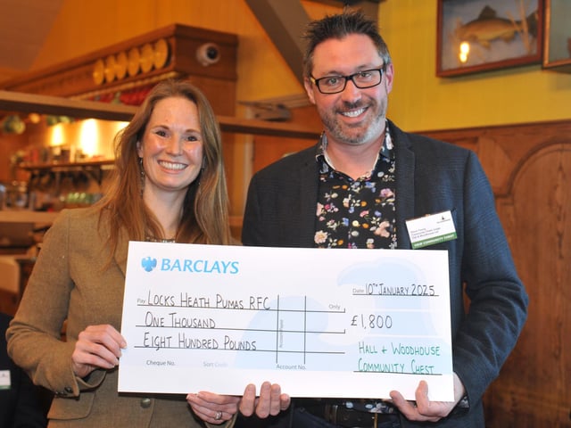 Judge Steve Young presents Locksheath Pumas RFC with £1,800 to buy new kit and storage