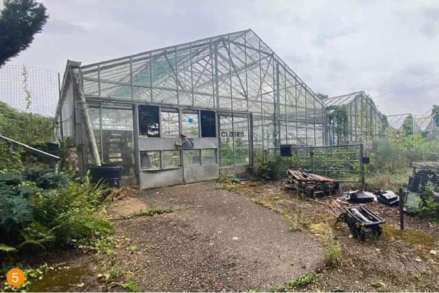 The demolition of a glasshouse to build seven new houses in a West Sussex village has been approved.