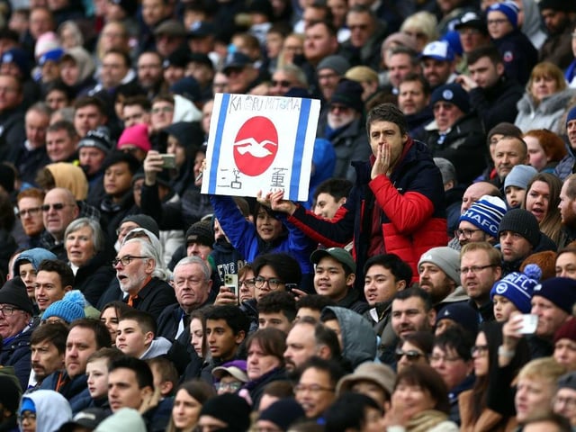 BRIGHTON, ENGLAND - JANUARY 29: Fans of Kaoru Mitoma of Brighton & Hove Albion show their support with a homemade Japan flag during the Emirates FA Cup Fourth Round match between Brighton & Hove Albion and Liverpool FC at Amex Stadium on January 29, 2023 in Brighton, England. (Photo by Bryn Lennon/Getty Images)