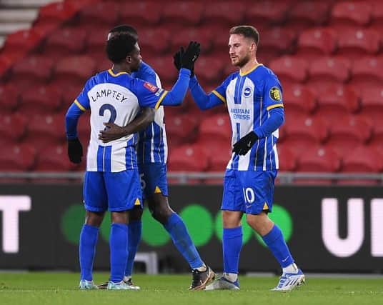 Alexis Mac Allister of Brighton & Hove Albion celebrates with teammate Tariq Lamptey after scoring the team's third goal at Middlesbrough