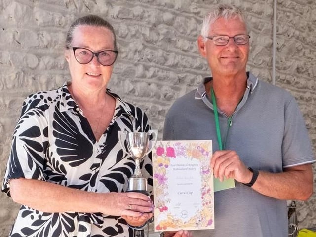 Julie Knight receives the Cactus Cup for cactus or succulent from chairman Chris Hill