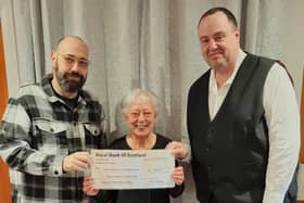 Left to Right: Brighton comedian Dave Fensome, Parkinson's Support Group representative, Judy Byrne, and Paul Margo of 3Degree Catering at the EBM Centre, Peacehaven.