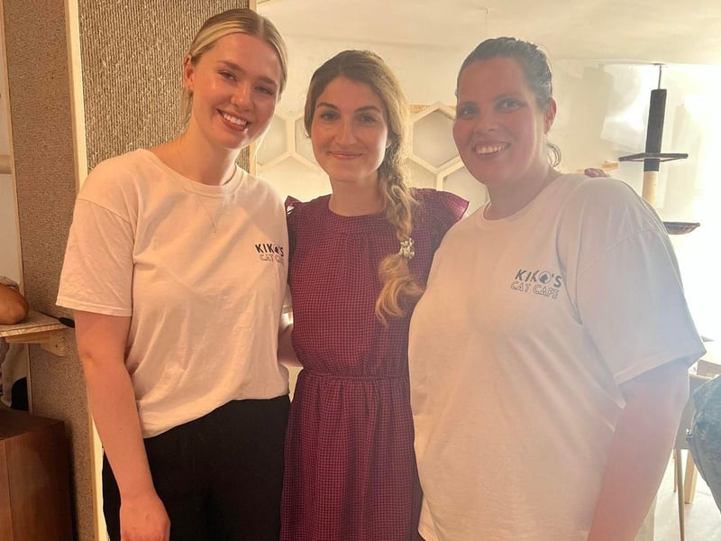 Kiko's owner April Benson (left) and PAW Society co-founder Lynda Humphrey-Stack (right) with Madalina Sbarcea who was responsible for rescuing many of the cats who have found a haven at Kiko's. Photo: Contributed.