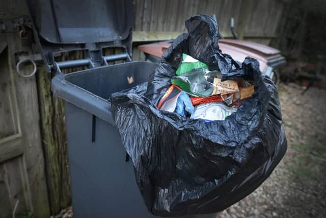 Black rubbish bin