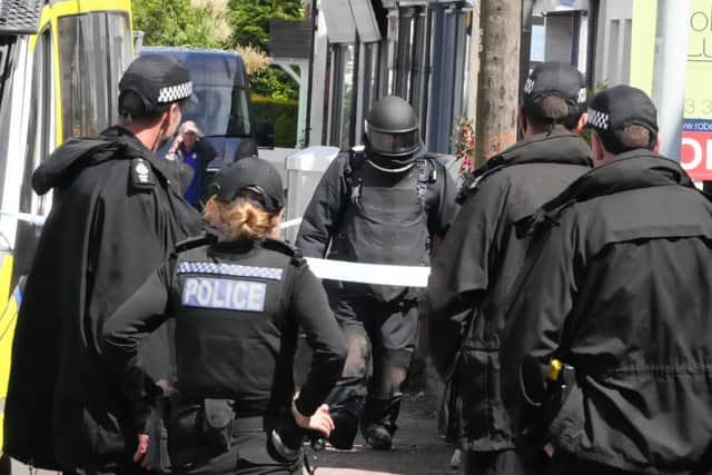 The bomb squad have joined Sussex Police officers at the scene in Tarring Road, Worthing. Photo: Eddie Mitchell
