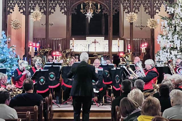 Uckfield Concert Brass performing for Carols by Candlelight at Holy Cross Church, Uckfield Carols